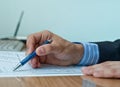 Businessman examining financial document