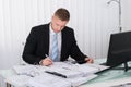 Businessman Examining Invoice Royalty Free Stock Photo