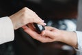 businessman exchange handing over the car keys for to a young women.