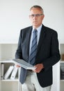 Businessman, expert or portrait documents in office for company contract, report information or confidential file. Male