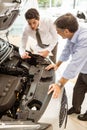 Businessman explaining the car details Royalty Free Stock Photo