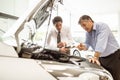 Businessman explaining the car details Royalty Free Stock Photo