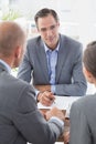 Businessman explaining contract to business partners Royalty Free Stock Photo