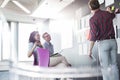 Businessman explaining documents to colleagues in creative office Royalty Free Stock Photo