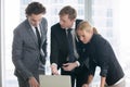 Businessman explaining presentation on laptop screen Royalty Free Stock Photo