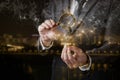 Businessman explores the network on a dark background using a magnifier