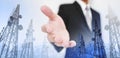 Businessman extending hand, with double exposure Telecommunication towers and city view background