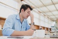 Businessman eyes pain. Tired, overworking and taking off glasses massaging eyes after long time working with laptop in office Royalty Free Stock Photo