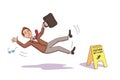 Businessman falling near Caution wet floor yellow sign Royalty Free Stock Photo