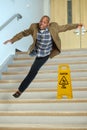 Businessman Falling on Stairs Royalty Free Stock Photo