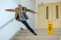 Businessman Falling on Stairwell Royalty Free Stock Photo