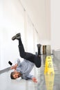 Businessman Falling on Wet Floor Royalty Free Stock Photo