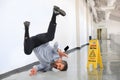 Businessman Falling on Wet Floor Royalty Free Stock Photo