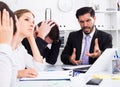 Businessman feeling angry to coworkers in office Royalty Free Stock Photo