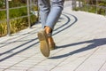 Businessman feet Man in gray pants walking on city street Business lifestyle Royalty Free Stock Photo