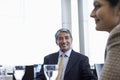 Businessman With Female Colleague In Restaurant