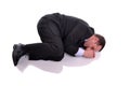 Businessman in fetal position