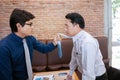 businessman fighting and disagree about business marketing in room background