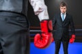 Businessman is fighting with his boss in boxing ring Royalty Free Stock Photo