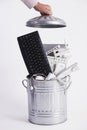 Businessman Filling Garbage Can With Obsolete Office Equipment Royalty Free Stock Photo