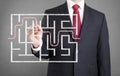 Businessman finding the solution of a maze Royalty Free Stock Photo