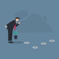 Businessman finding trail of money vector illustration