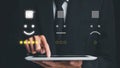 Businessman finger pointing smiley face emoticon on virtual touch screen.good feedback rating and positive customer review