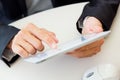 Businessman finger pointing to the screen of a digital tablet. Royalty Free Stock Photo