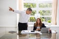 Businessman Firing Upset Female Employee Royalty Free Stock Photo