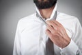 Businessman fixing his tie. Fashion, Lifestyle Royalty Free Stock Photo