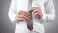 Businessman fixing his tie. Fashion, Lifestyle Royalty Free Stock Photo