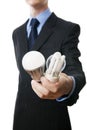 Businessman with fluorescent and LED lamps and incandescent Royalty Free Stock Photo