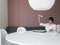 Businessman Flying Airplane At Office Desk