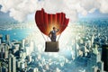 The businessman flying on balloon in challenge concept