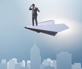 Businessman flying on paper plane in business concept Royalty Free Stock Photo