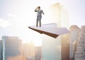 Businessman flying on paper plane in business concept Royalty Free Stock Photo