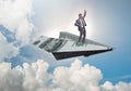 Businessman flying on paper plane in business concept Royalty Free Stock Photo