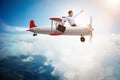 The businessman flying on vintage old airplane Royalty Free Stock Photo