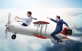 Businessman flying on vintage old airplane Royalty Free Stock Photo