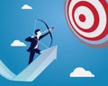 Businessman focus to hit target with bow and arrow