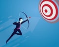 Businessman focus to hit target with bow and arrow