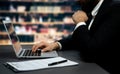 Businessman focused on his laptop working on financial report. Equilibrium Royalty Free Stock Photo