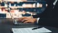 Businessman focused on his laptop working on financial report. Equilibrium Royalty Free Stock Photo