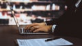 Businessman focused on his laptop working on financial report. Equilibrium Royalty Free Stock Photo