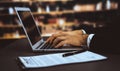 Businessman focused on his laptop working on financial report. Equilibrium Royalty Free Stock Photo