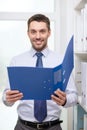 Businessman with folder at office Royalty Free Stock Photo