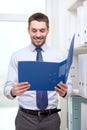 Businessman with folder at office Royalty Free Stock Photo