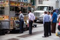 Businessman at food cart in New York