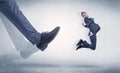 Businessman foot kicking small businessman