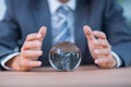 Businessman forecasting a crystal ball Royalty Free Stock Photo